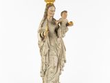 a statue of a woman holding a child with a crown on her head
