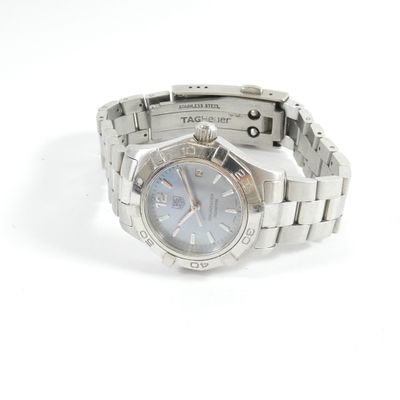 a watch that is sitting on a white surface