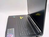 a laptop computer sitting on top of a white table