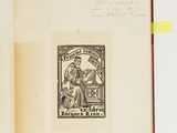 an open book with a drawing of a man sitting on a bench