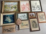 a lot of framed pictures on the wall