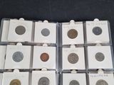 several different types of coins are in a clear plastic case