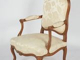 an image of a chair with a beige upholstered back and arms
