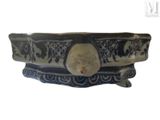 a blue and white bowl with elephants on it