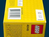 a box of legos sitting on a blue surface