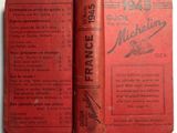 a red book that is open on a white table