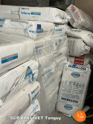a large pile of toilet paper sitting on top of a pile of boxes