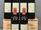 six bottles of red wine in a wooden box on a grey background