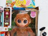 a stuffed animal and toys on a table next to each other