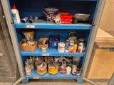 a blue cabinet with a lot of items on it