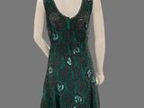 an image of a mannequin wearing a green and black dress