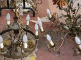 a chandelier that has a lot of candles on it