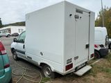 a white van that is parked in a parking lot