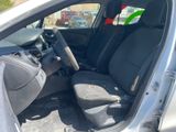 the interior of a car with the door open and the seat up