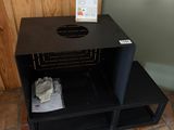a black shelf that has some items in it
