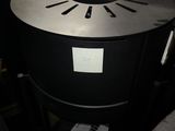 an image of a black and silver table with a clock on it