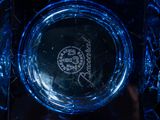 a close up of a glass plate with a logo on it