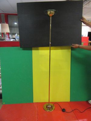a man that is standing next to a television