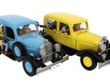 yellow and blue toy cars with people in them on a white background