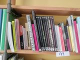 a bookshelf with many books on it in a room