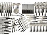 an assortment of silverware including forks, knives and spoons