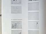 someone is holding a book open to a page with drawings on it