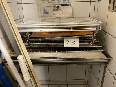 a metal rack with a tray of food on top of it