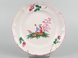 a picture of a plate with a bird and flowers on it