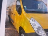a picture of a yellow van parked in a parking lot