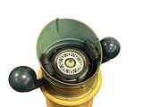 an image of a green and yellow fire hydrant with a compass