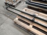 many pallets of wood sitting on the floor in a warehouse