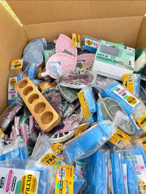 a cardboard box full of assorted household items