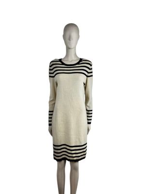 an image of a mannequin mannequin wearing a white and black striped dress
