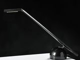 a black and white photo of a desk lamp