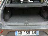the back of a car with its trunk open on a dirt road