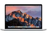 an apple macbook pro laptop computer with a mountain range in the background