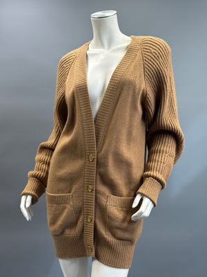an image of a mannequin mannequin wearing a brown cardigan sweater