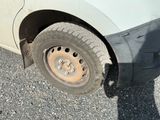 a car that has a flat tire on the road