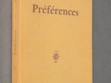 the cover of the book preferencess is shown on a gray surface