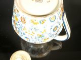an image of a cup and a coin on a table