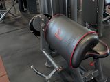 a gym room with a bench, weights, and other equipment