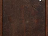 an old wooden box with a tag hanging on it