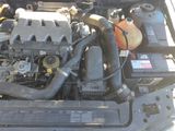 a picture of a car ' s engine with its hood open