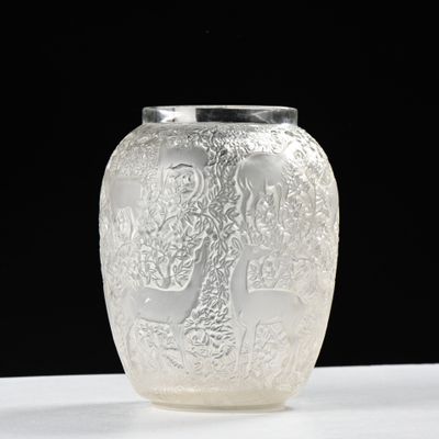 a glass vase that is sitting on a table