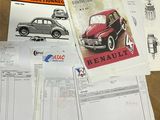 a table with a lot of papers and a car on it