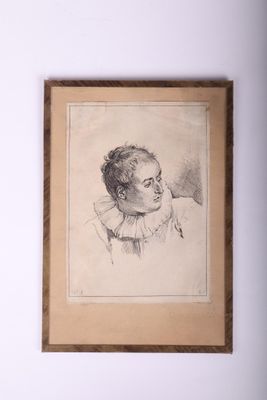 portrait d'un homme en chemise à col, encadré dans un cadre en bois