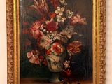 a painting of flowers in a vase on a table