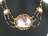 a close up of a necklace on a mannequin mannequin