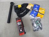 the contents of a tripod and other items are laid out on the floor