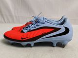 the nike vapor vapor soccer cleat has a bright blue and red color scheme